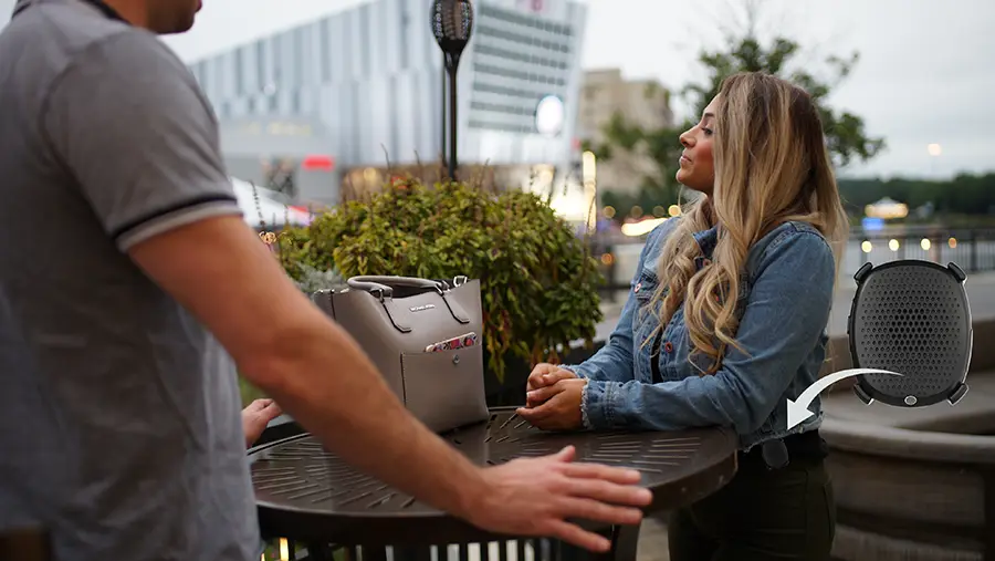 Photo of a woman on a date carrying a silent beacon safety panic button