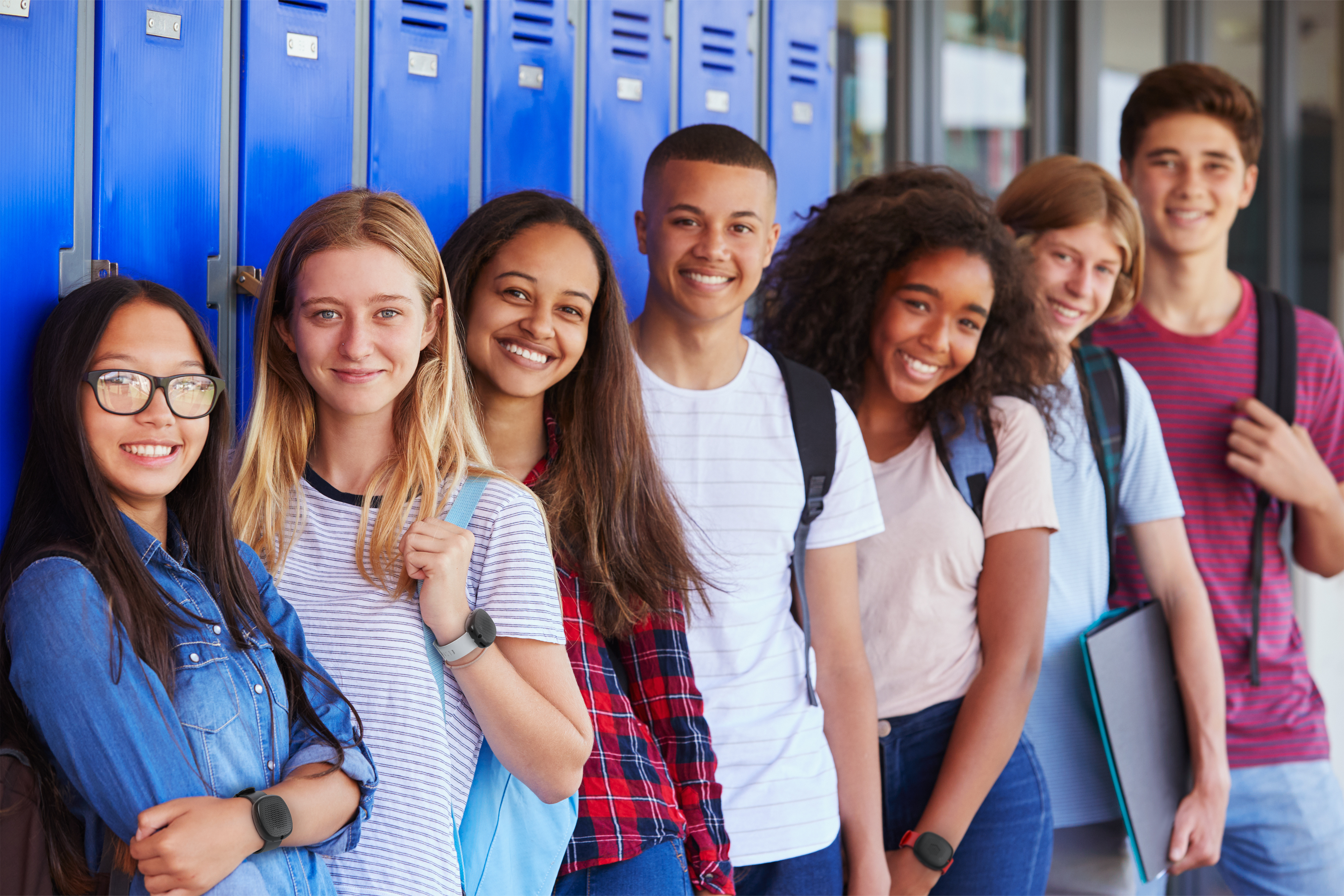 Students wearing Silent Beacon panic buttons on their wrists.