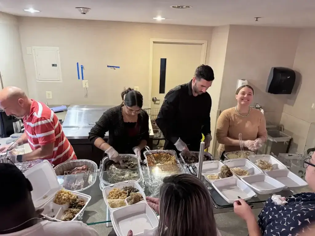 Silent Beacon staff serving thanksgiving lunch