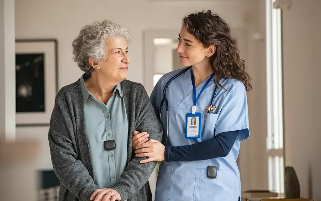 Nurse and patient using wearable duress buttons from Silent Beacon.