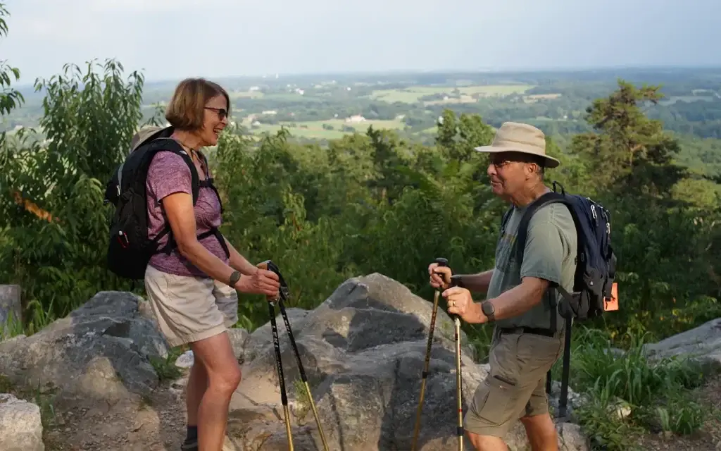 Seniors hiking while wearing panic buttons.