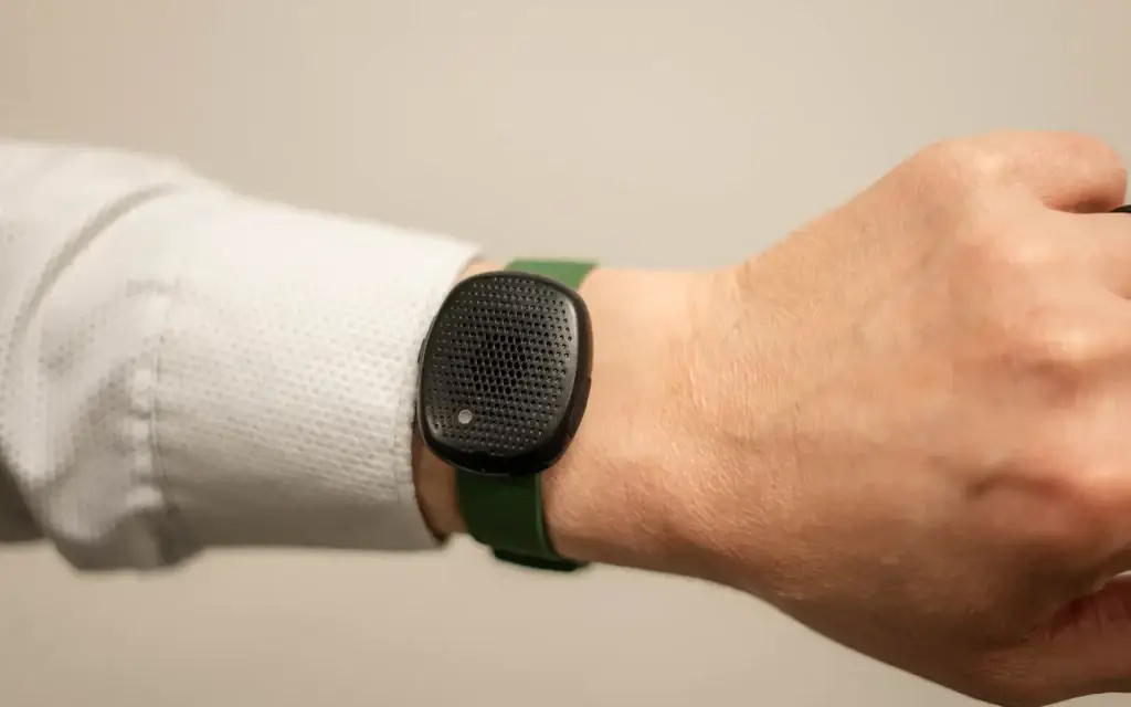 The Silent Beacon portable panic button being worn around a man's wrist.