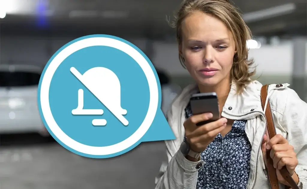Woman in Parking Lot enabling Silent Mode