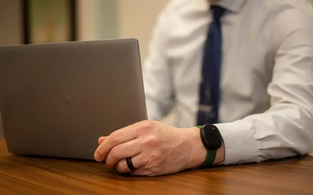 Wearable panic button on man's wrist.