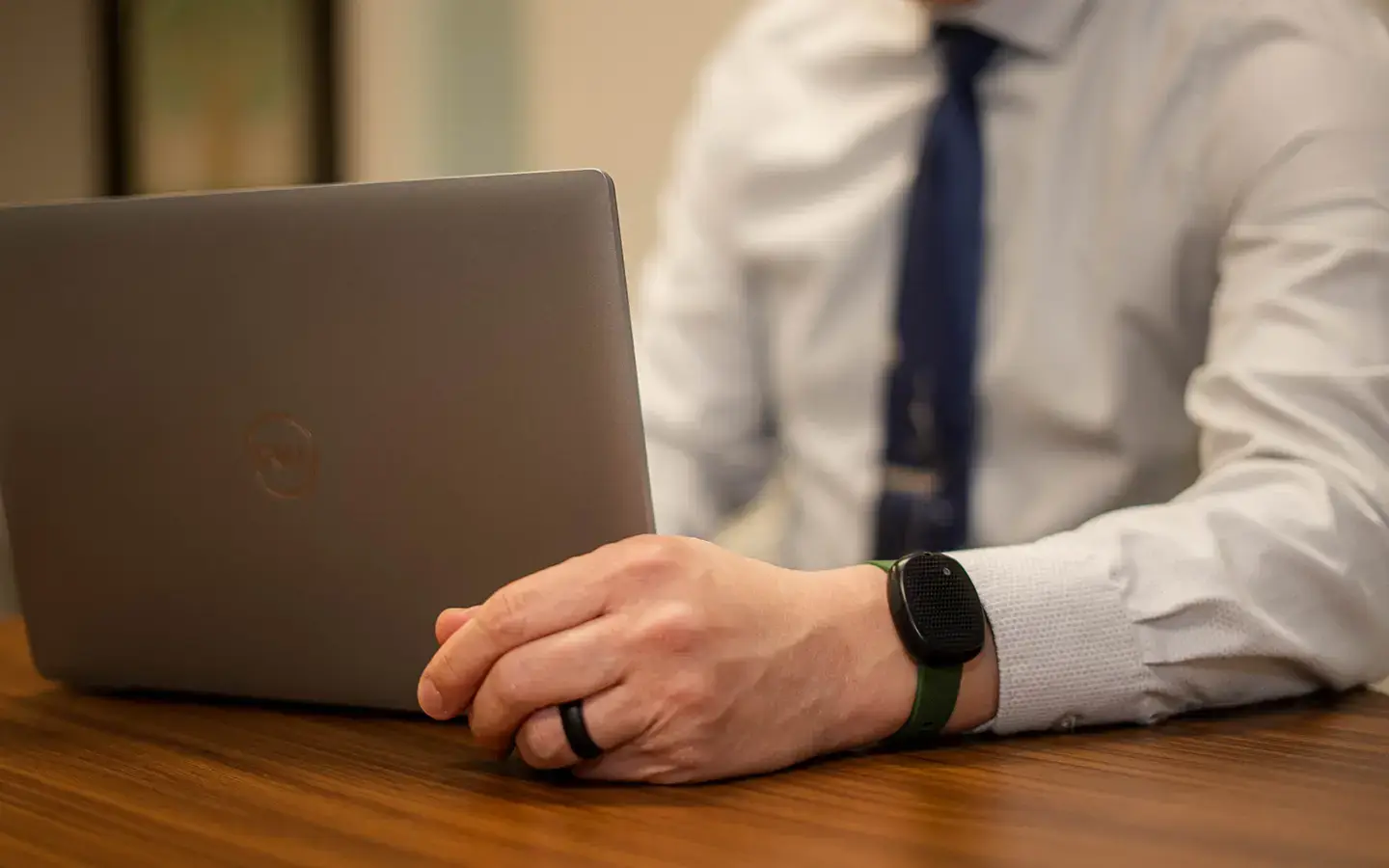 Wearable panic button on man's wrist.