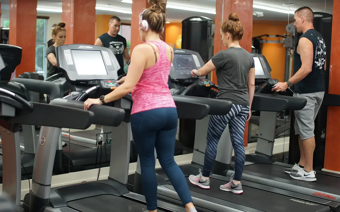Woman Using Panic Button In Gym