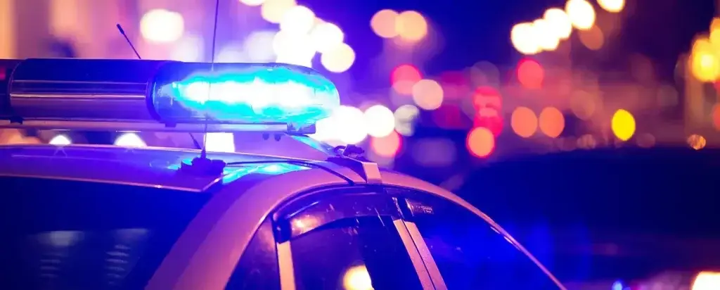 Police lights responding to night scene