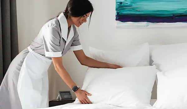 Hotel Worker using the Silent Beacon panic button for businesses